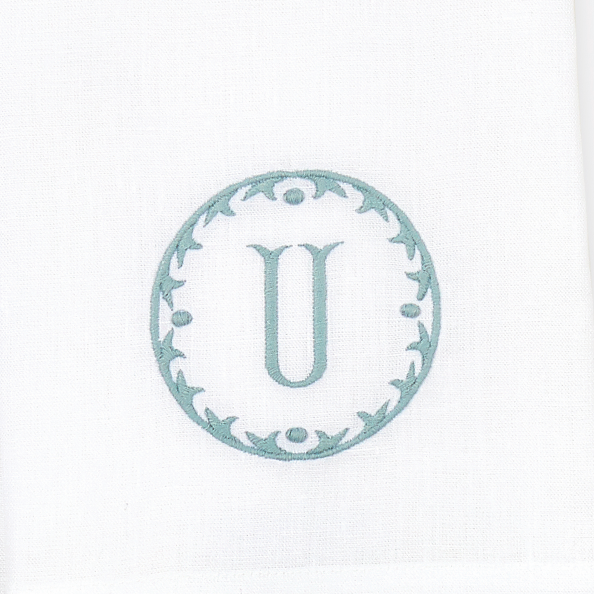 Closeup of Matouk Carta Guest Towels Letter U