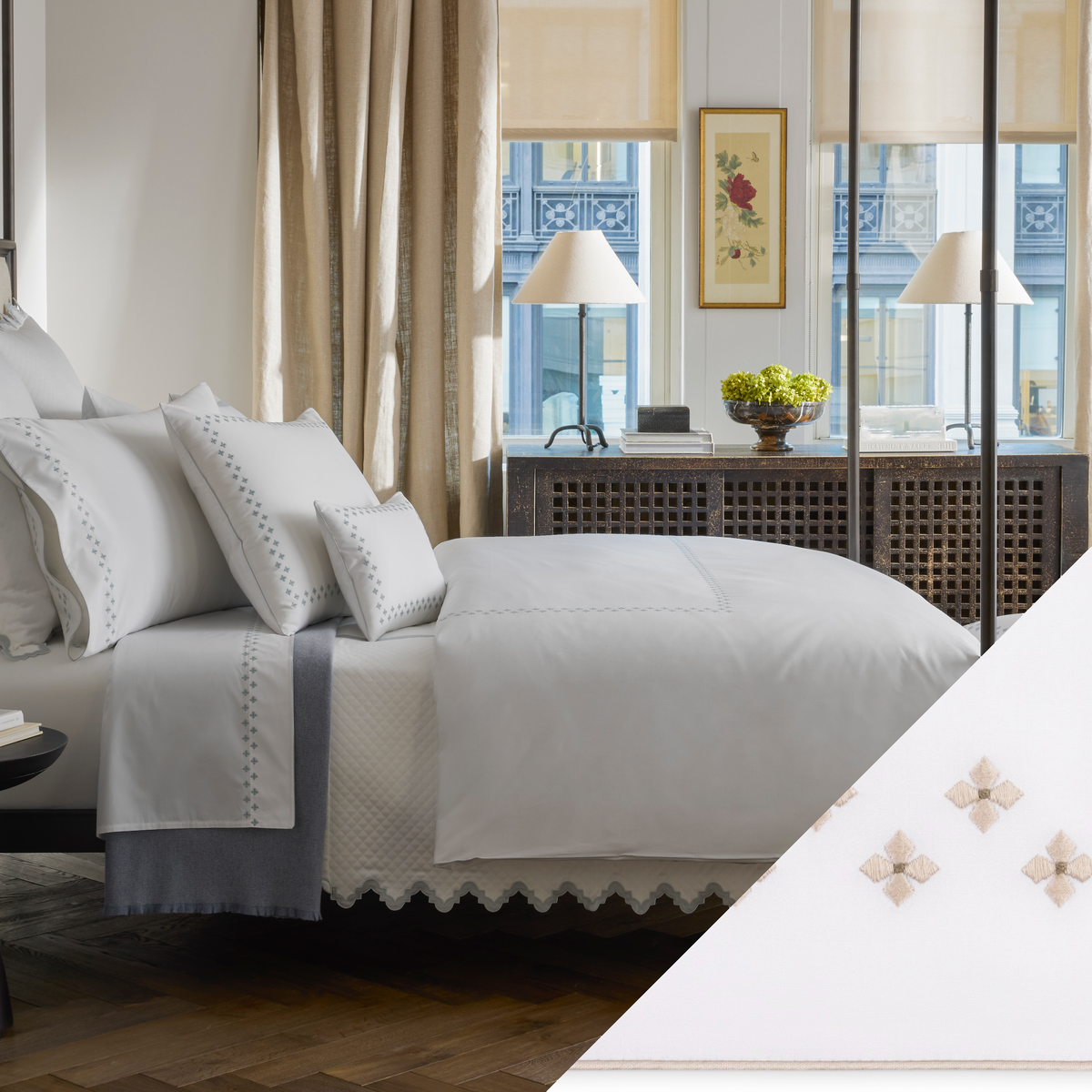 A neatly made bed with Matouk Casablanca bedding features Fine Dune color Embroidered Swatch