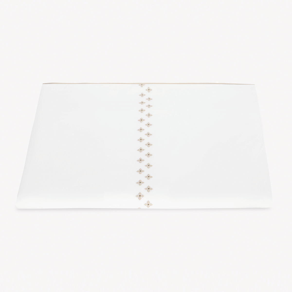 A folded white Egyptian cotton percale Duvet Cover featuring Matouk Casablanca Embroidery in Dune color