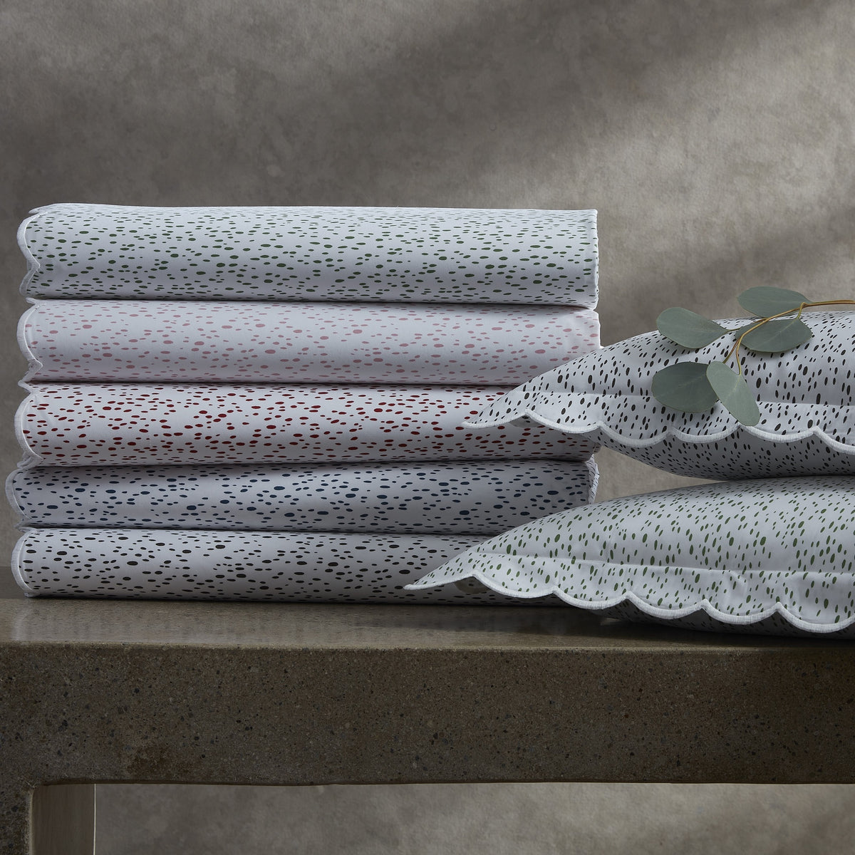 Stack of Matouk Celine Bedding in Different Colors