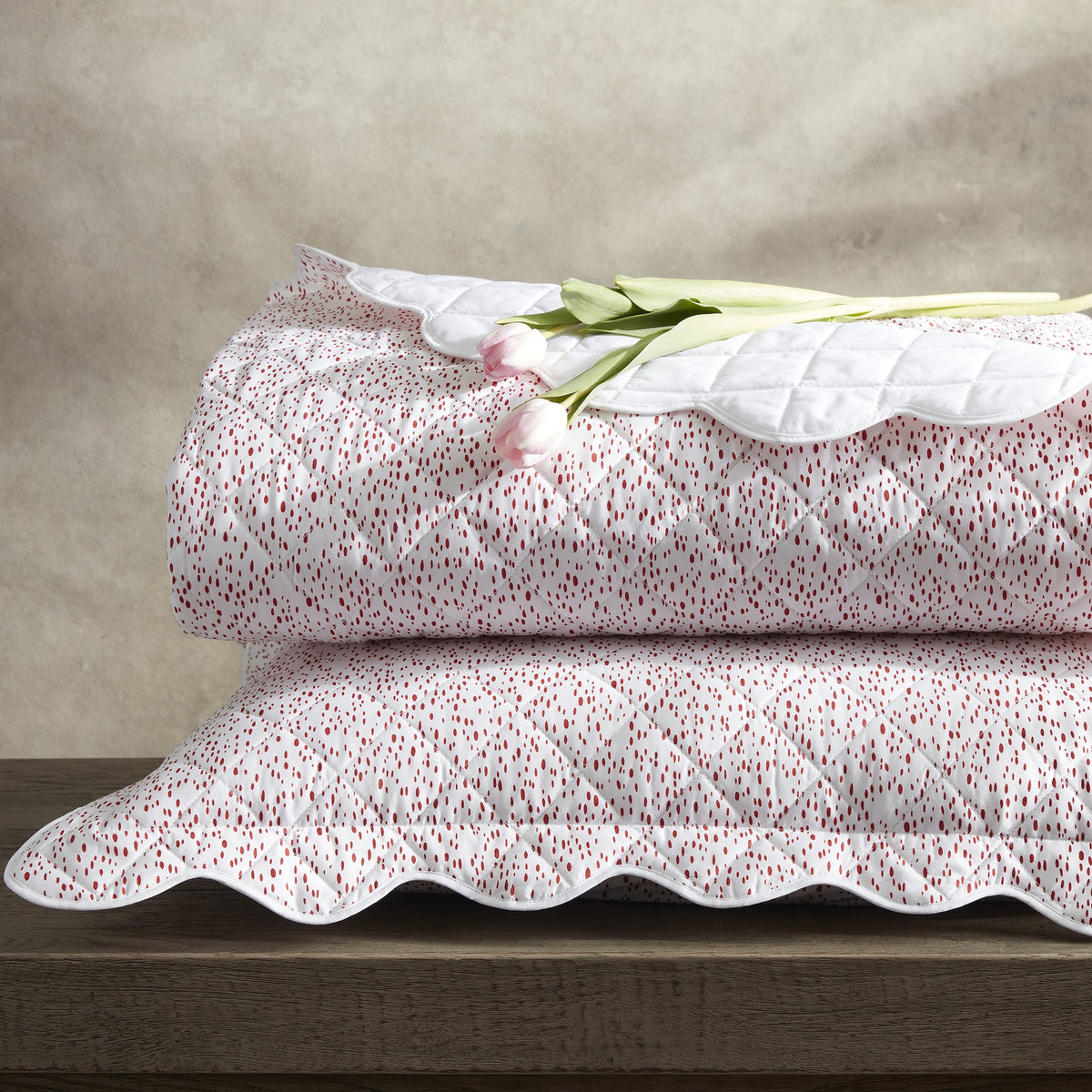 Stack of Matouk Celine Quilted Bedding in Redberry Color
