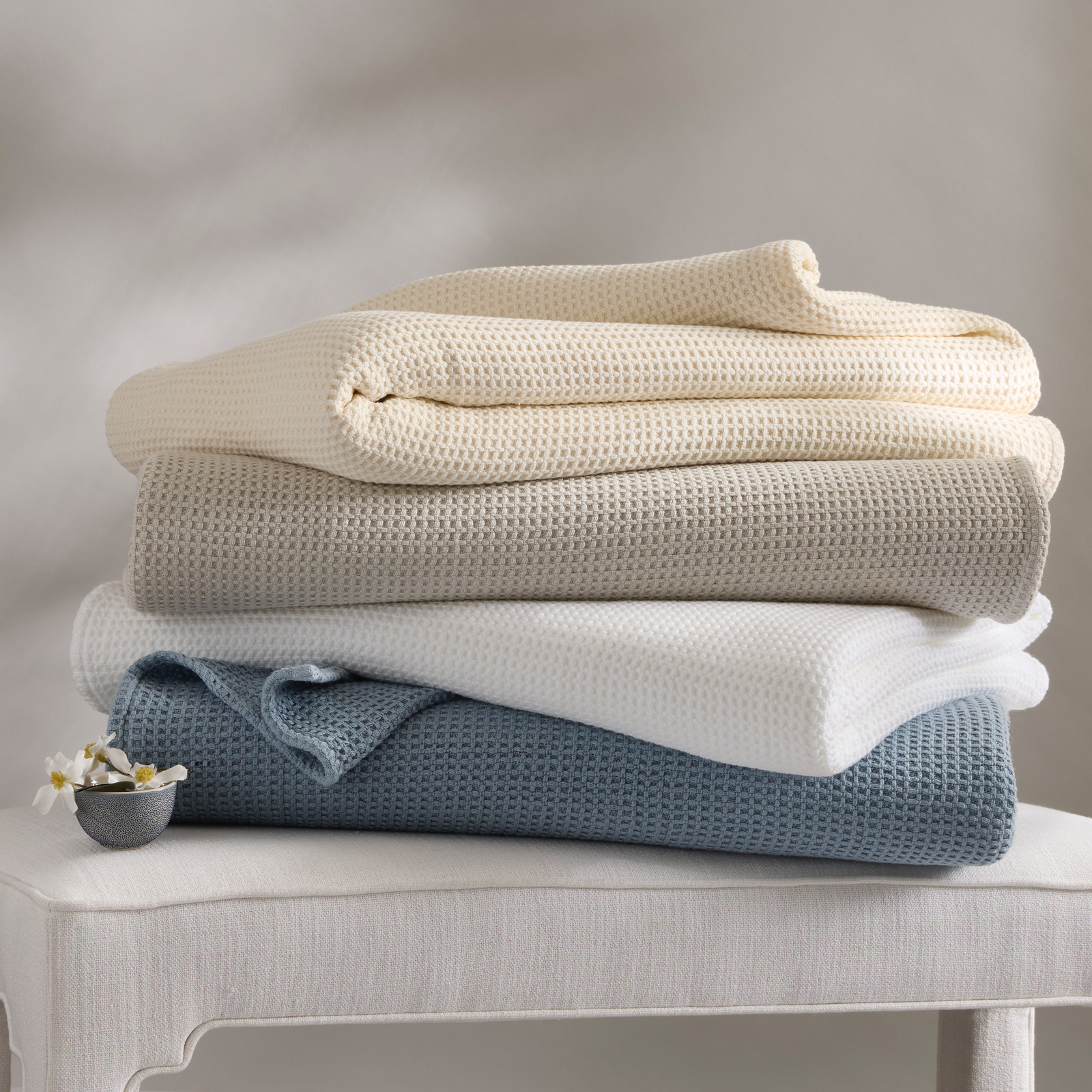 Stack of Matouk Chatham Blankets in all colors