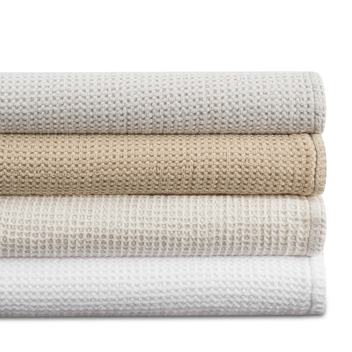 Stack of Matouk Chatham Blankets in Different Colors