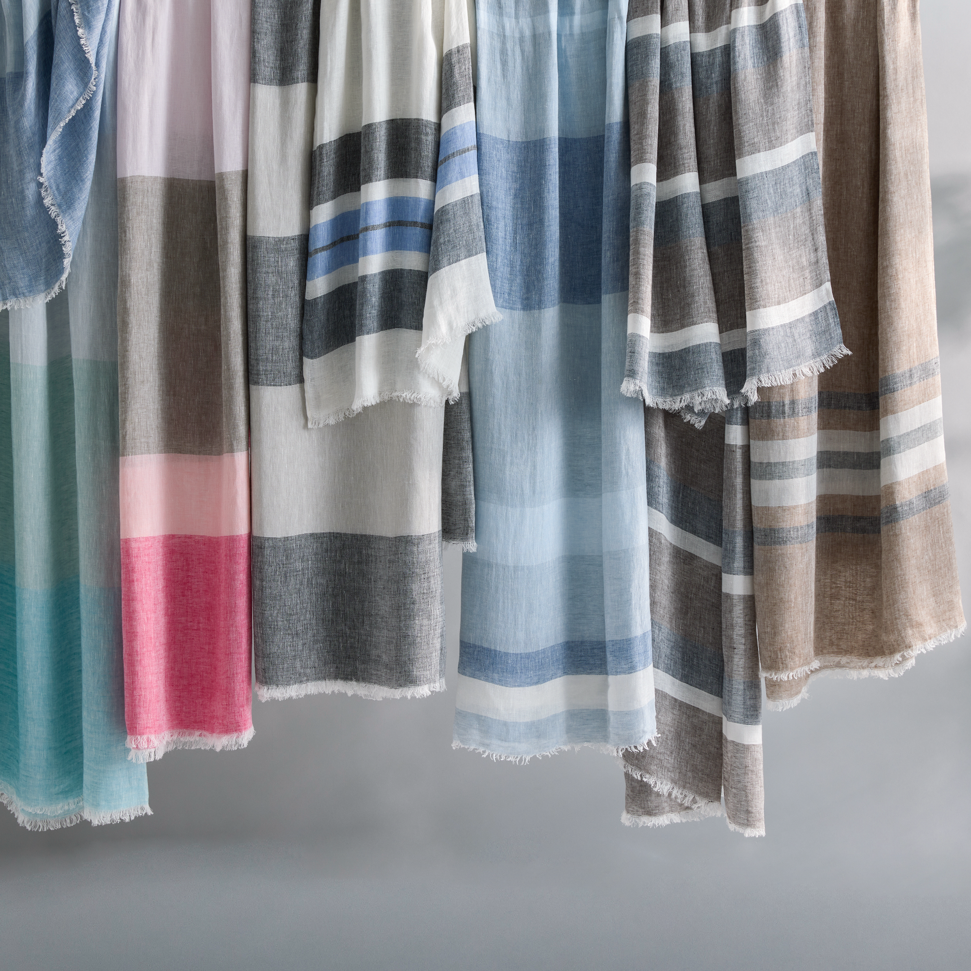 All Colors of Matouk Como 360 Throws Hanging