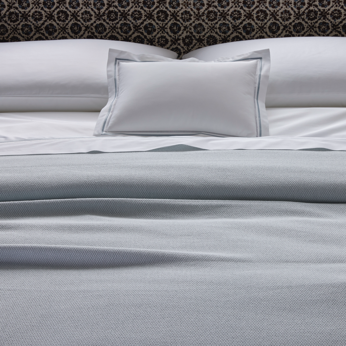 Matouk Costa Mesa blanket with Essex Bedding both in Pool color