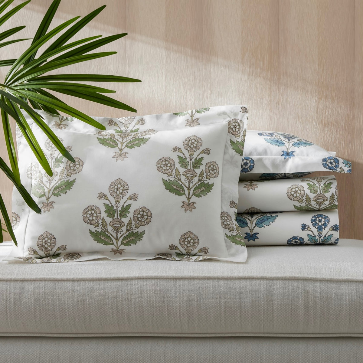Stack of Matouk Dalila Bedding in Pebble and Mineral Blue