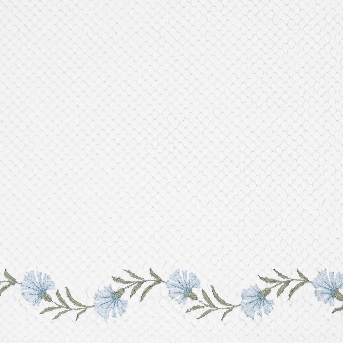 Closeup of Matouk Daphne Bath Rug with Blue Bell Color Embroidery