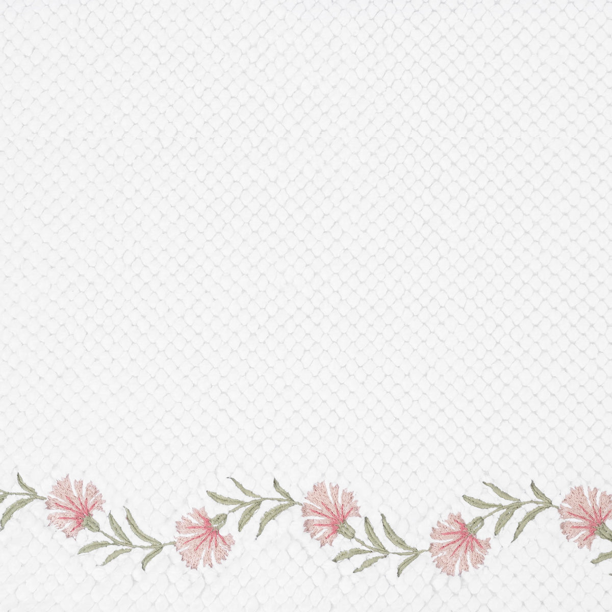 Closeup of Matouk Daphne Bath Rug with Blush Color Embroidery