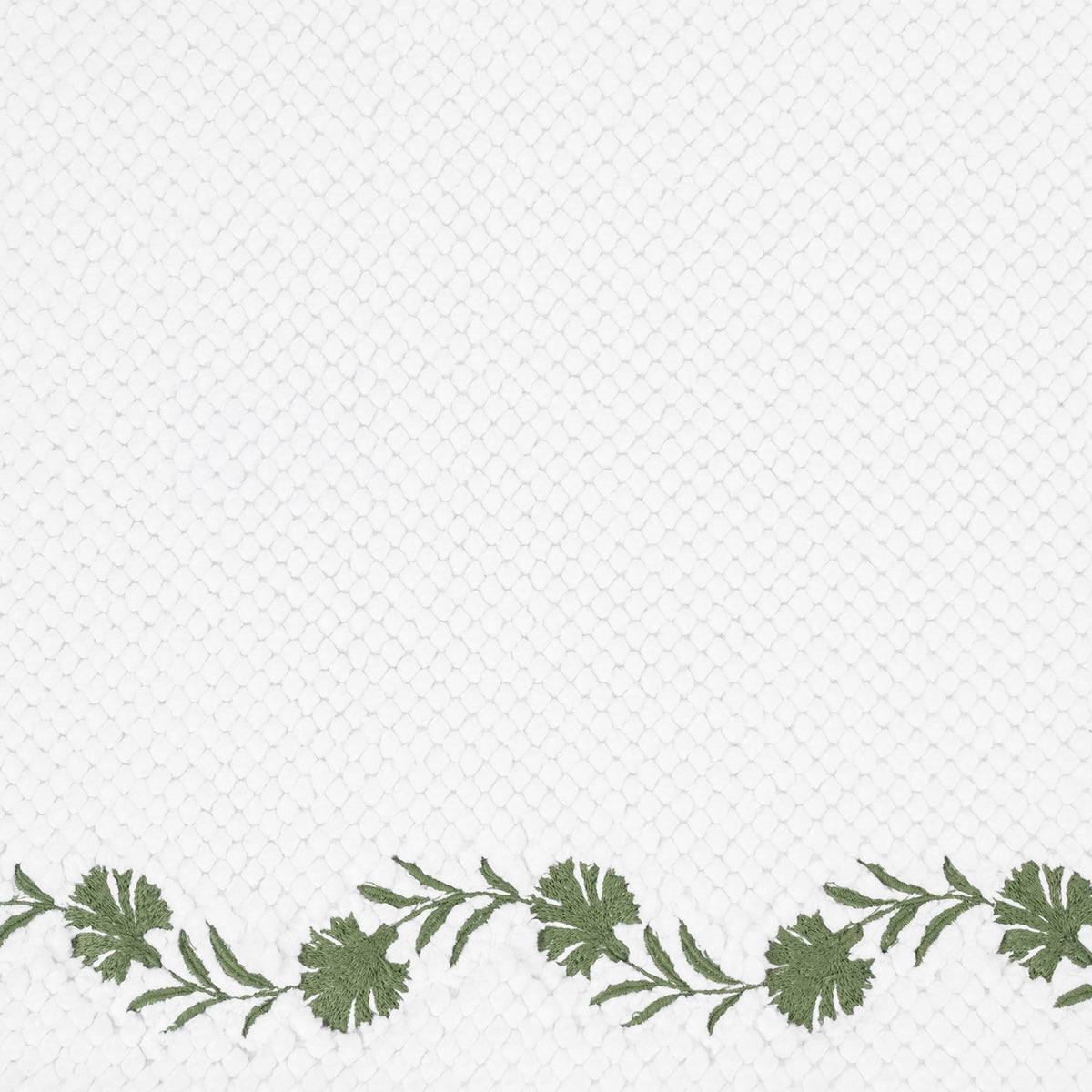 Closeup of Matouk Daphne Bath Rug with Clover Color Embroidery