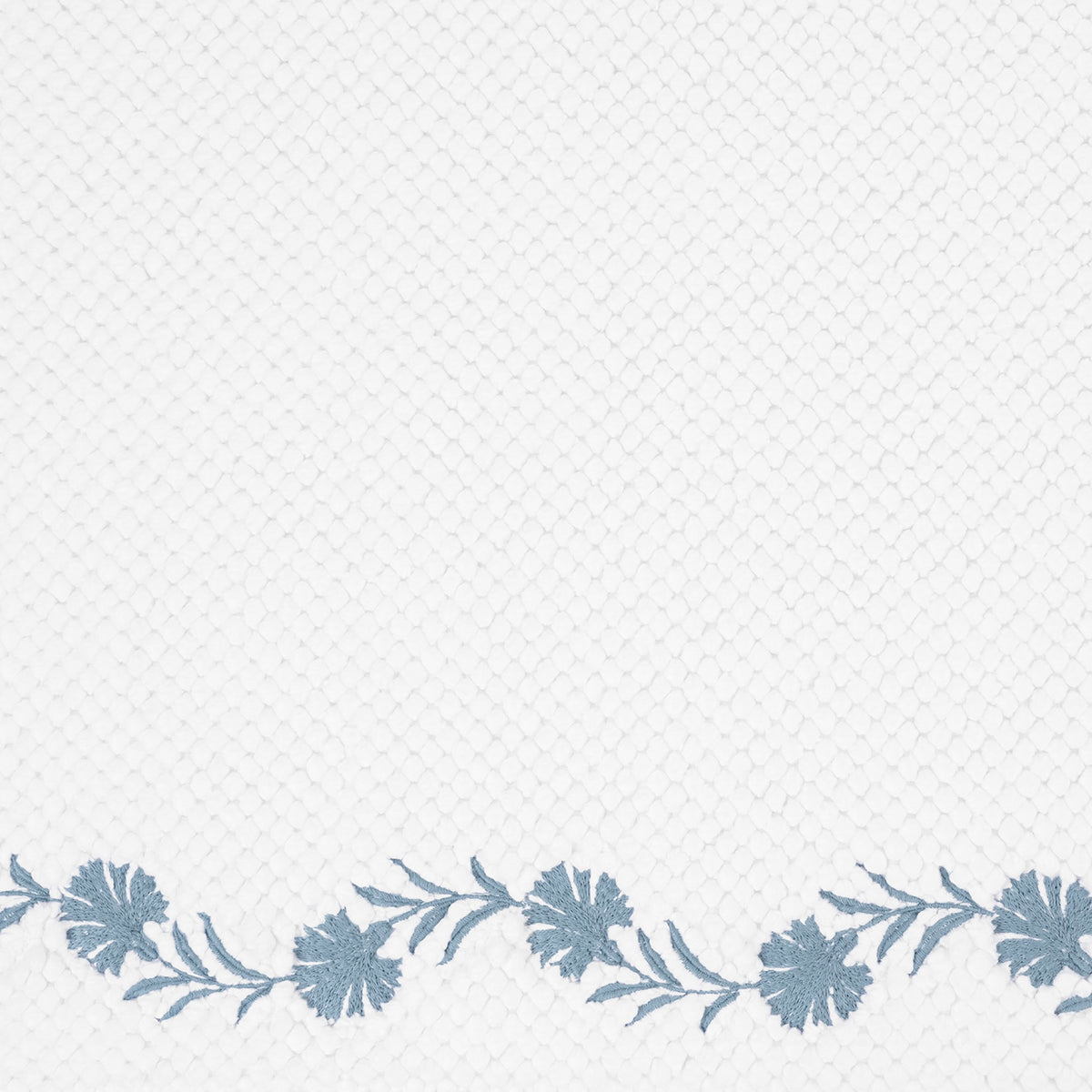 Closeup of Matouk Daphne Bath Rug with Hazy Blue Color Embroidery
