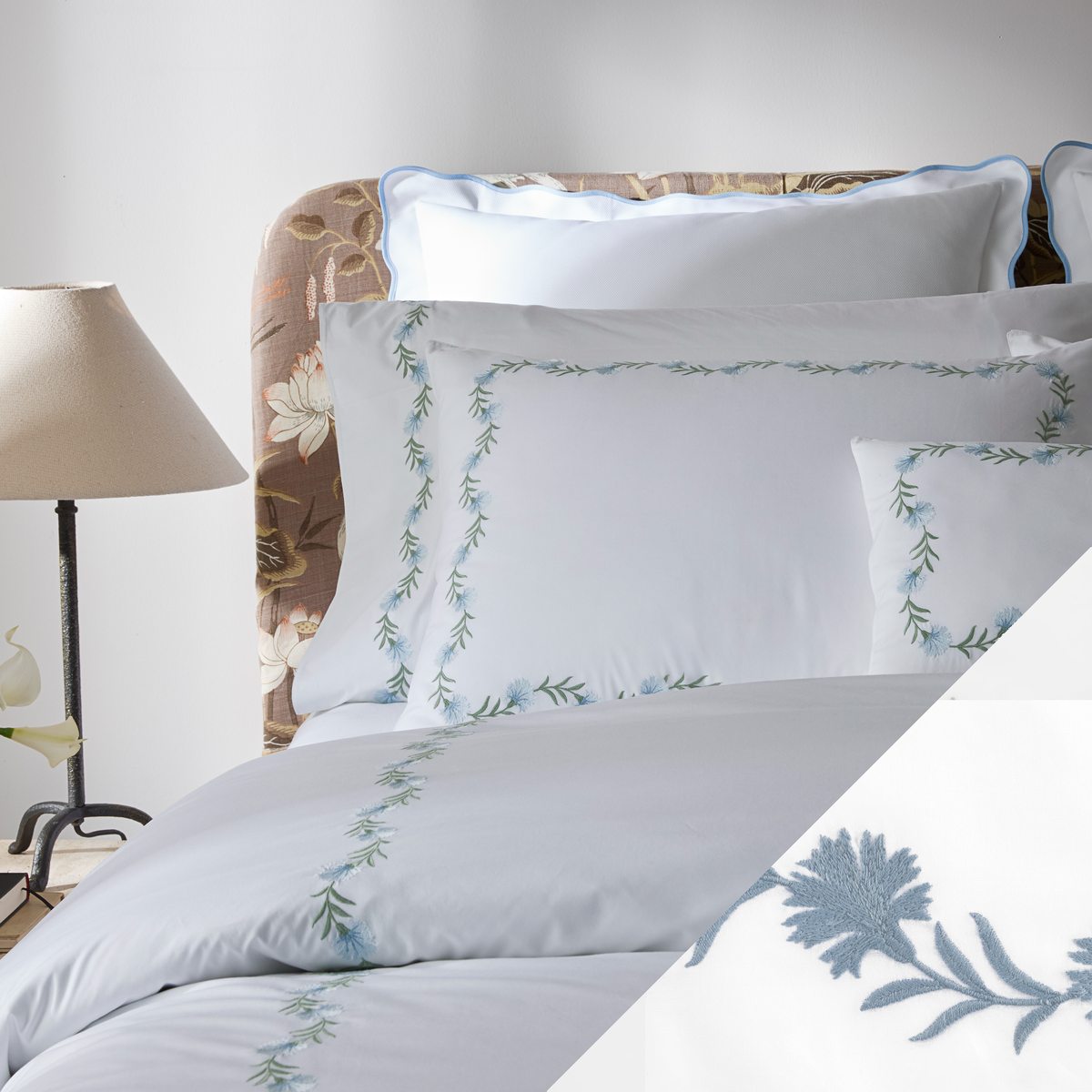Closeup of bed in Matouk Daphne Bedding Collection with Hazy blue swatch