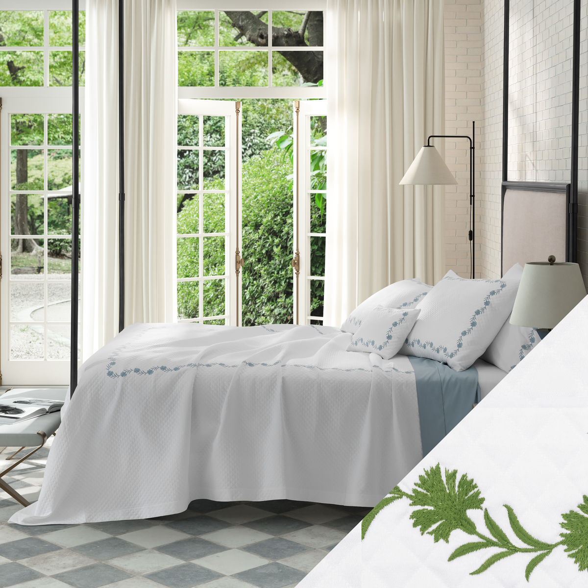 Bed in Matouk Daphne Matelasse Bedding with Grass design and a view of greenery outside