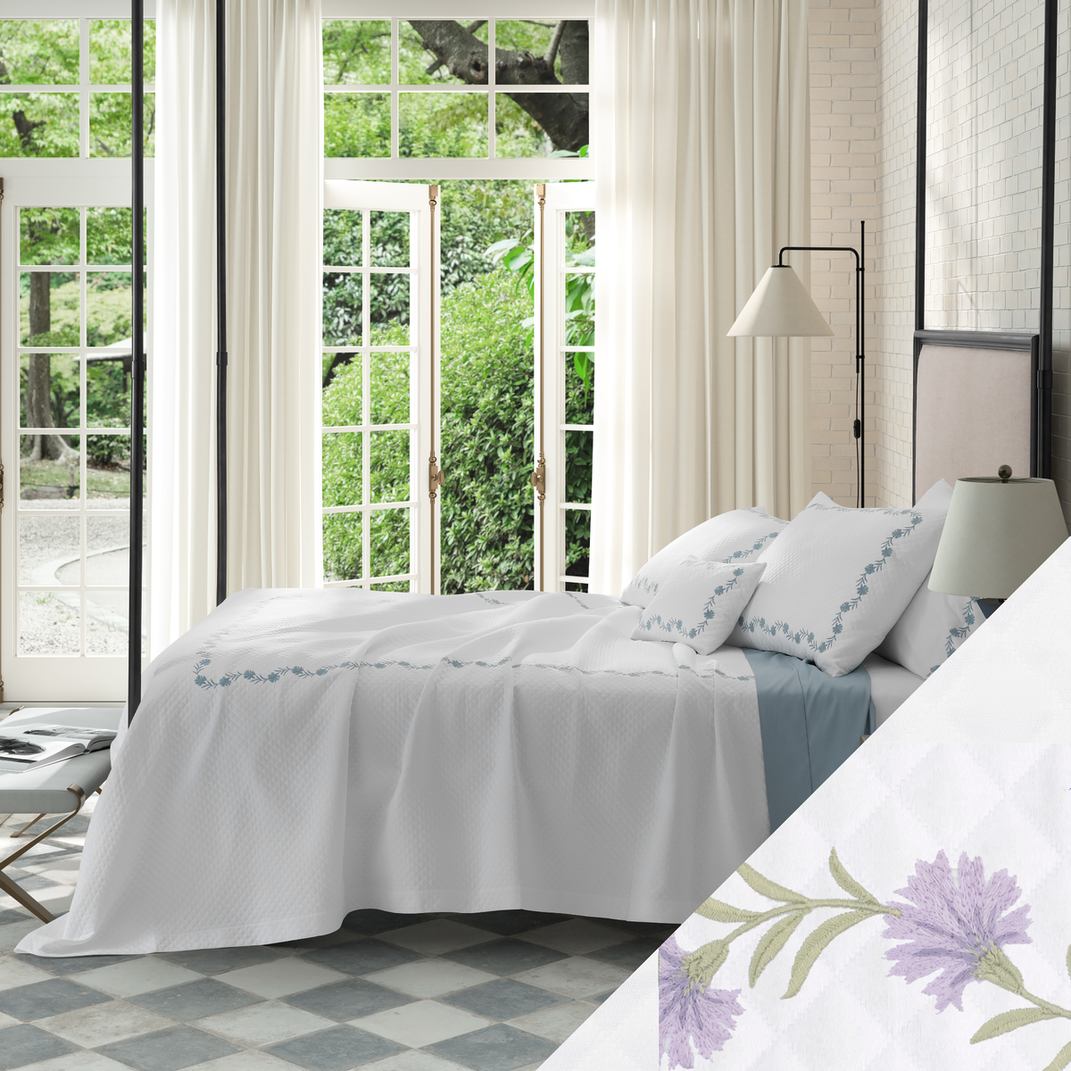 Bed in Matouk Daphne Matelasse Bedding with Lilac design and a view of greenery outside