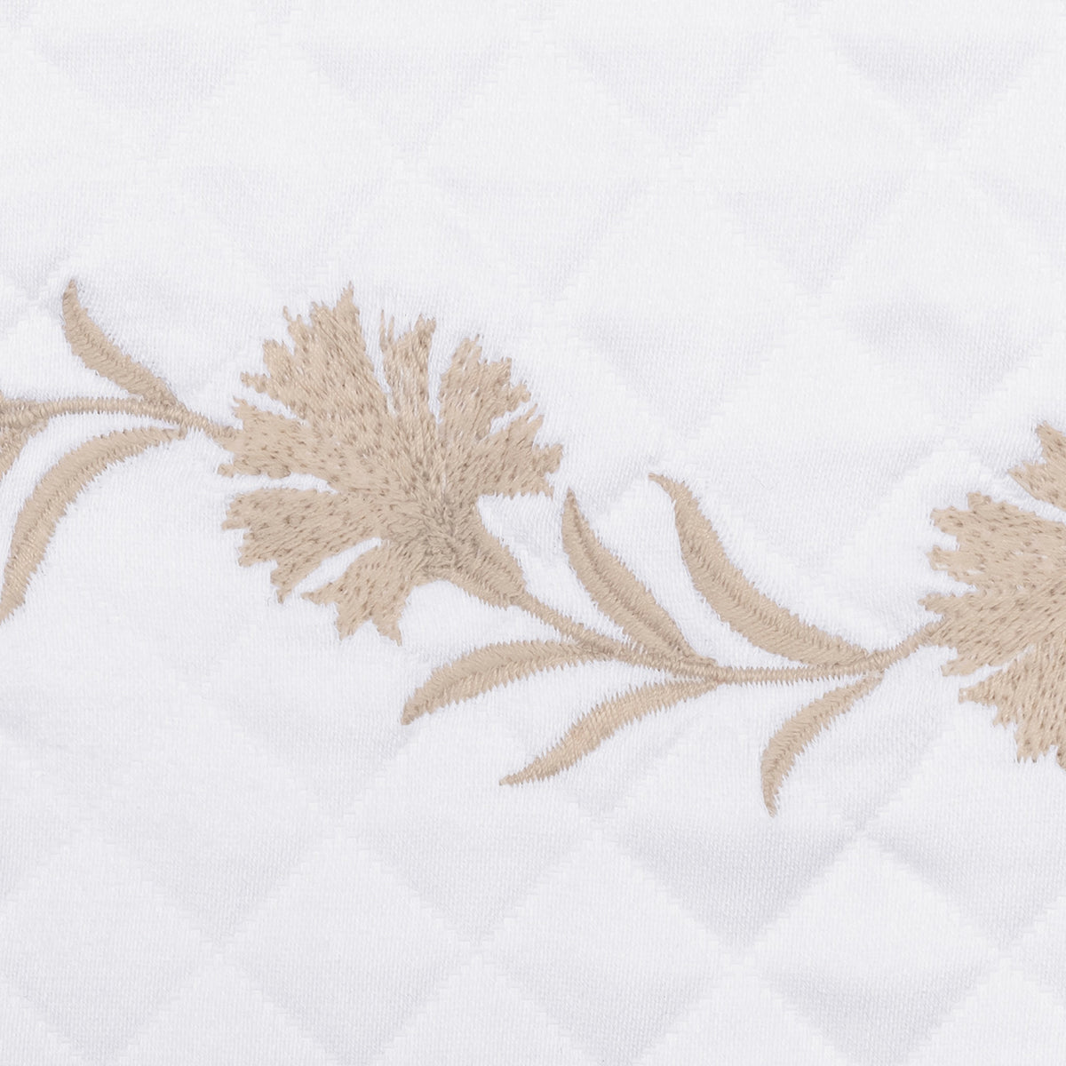 Dune embroidered florals with leaves on white OEKO-TEX certified cotton matelassé, featuring a Matouk Matelasse fabric
