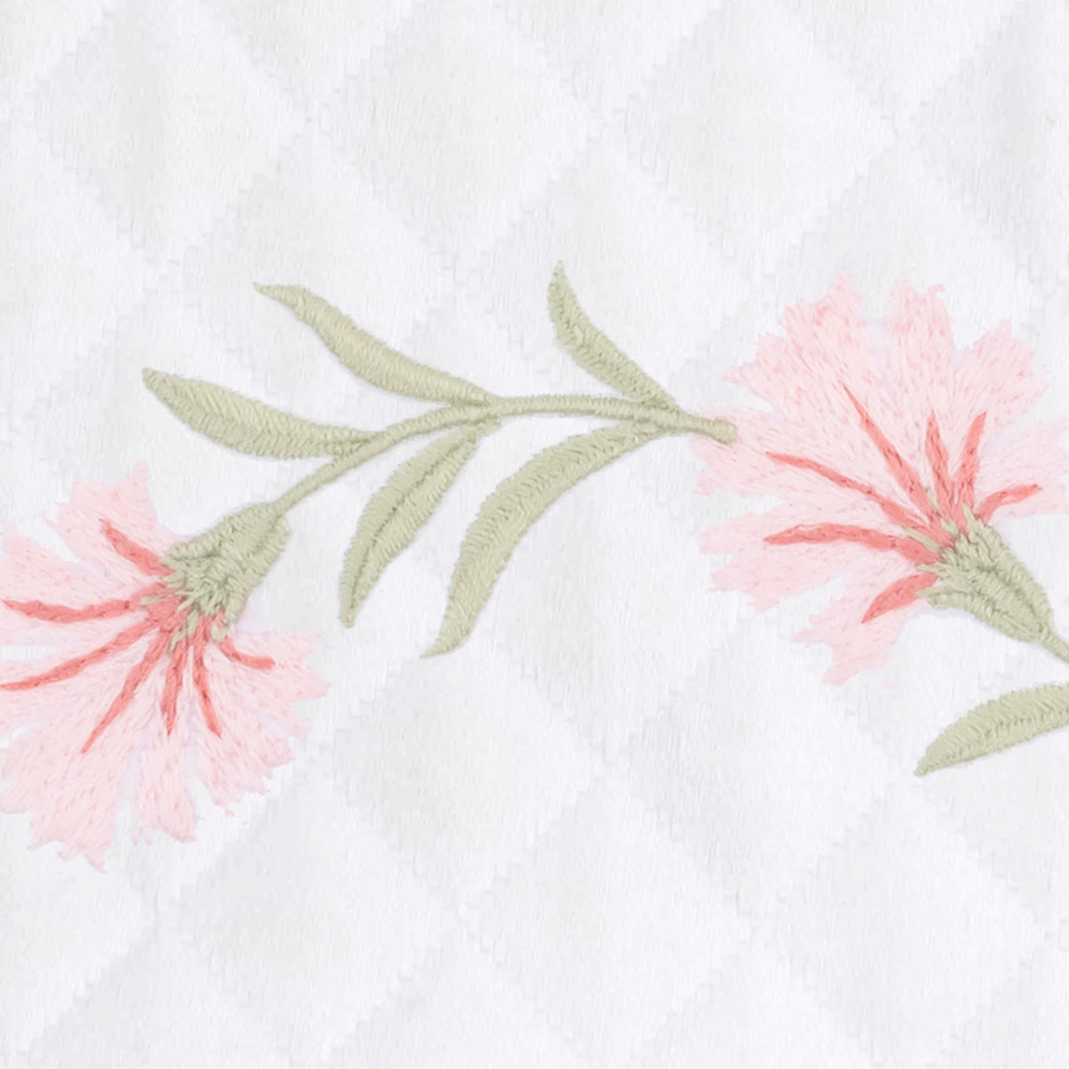 Peony embroidered florals with leaves on white OEKO-TEX certified cotton matelassé, featuring a Matouk Matelasse fabric