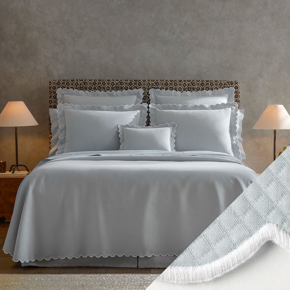  neatly made bed with Matouk Diamond Pique Bedding, two lamps on nightstands, and a close-up of Pool swatch