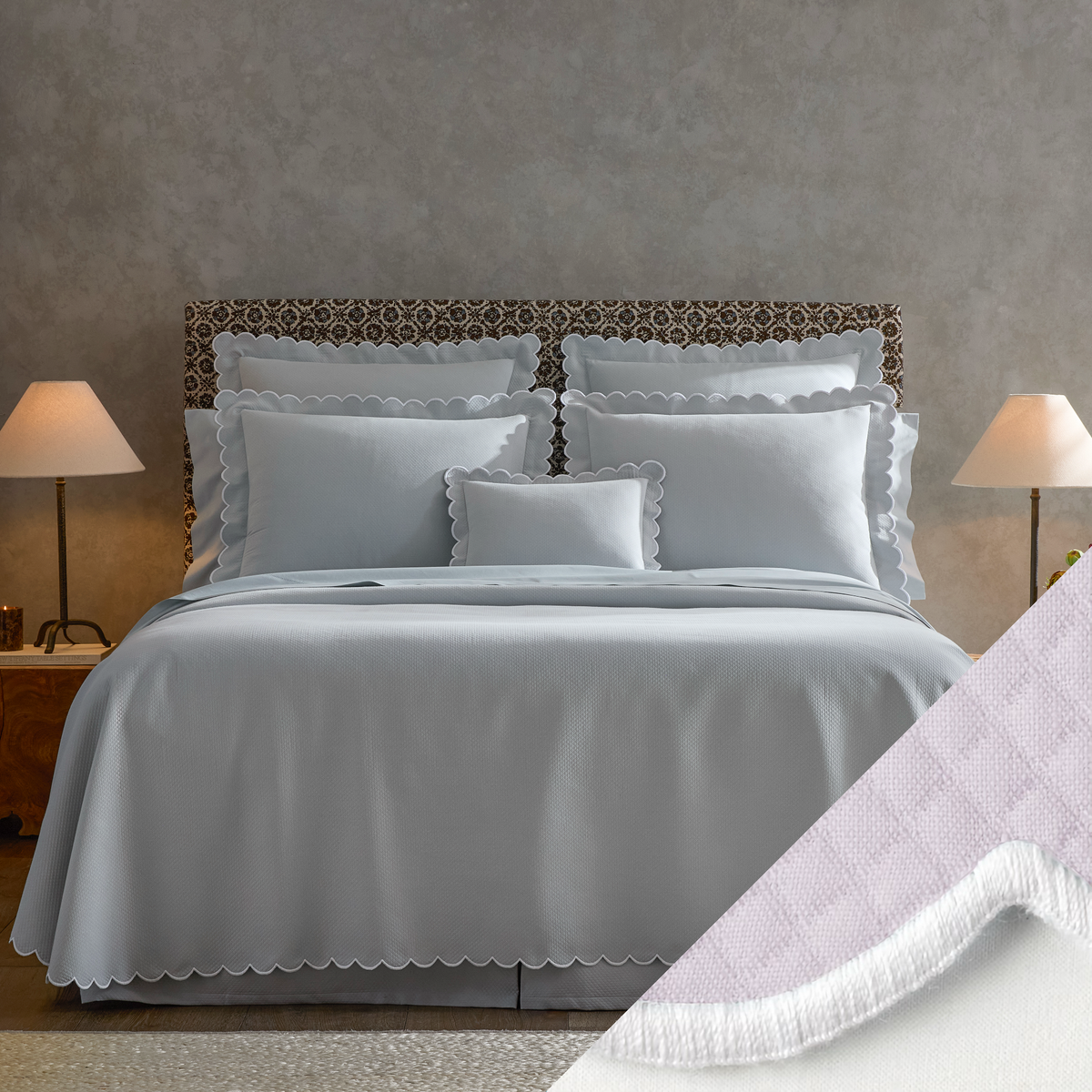  neatly made bed with Matouk Diamond Pique Bedding, two lamps on nightstands, and a close-up of Violet swatch