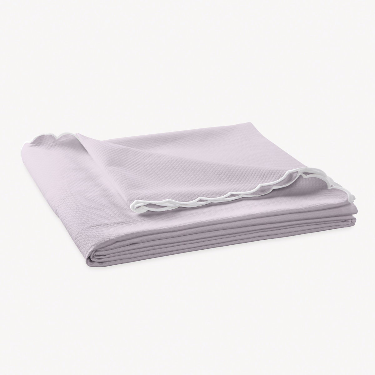 Folded Coverlet of Matouk Diamond Pique Bedding in Violet color