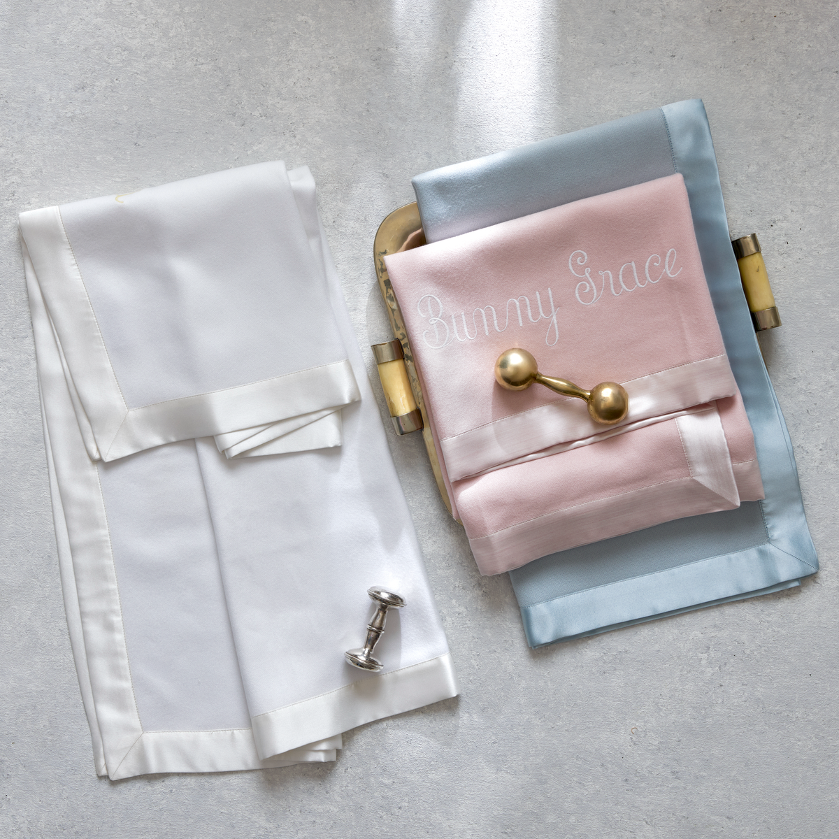 Folded Matouk Dream Modal Little Blankets with satin trim