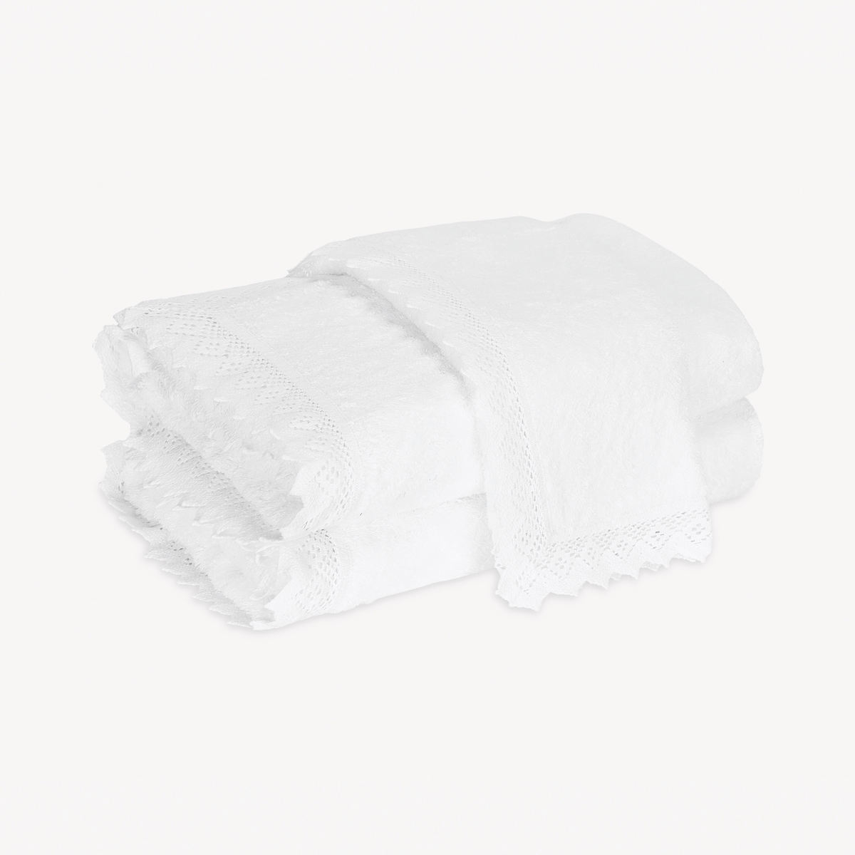 Folded White Matouk Ellis Bath Towels