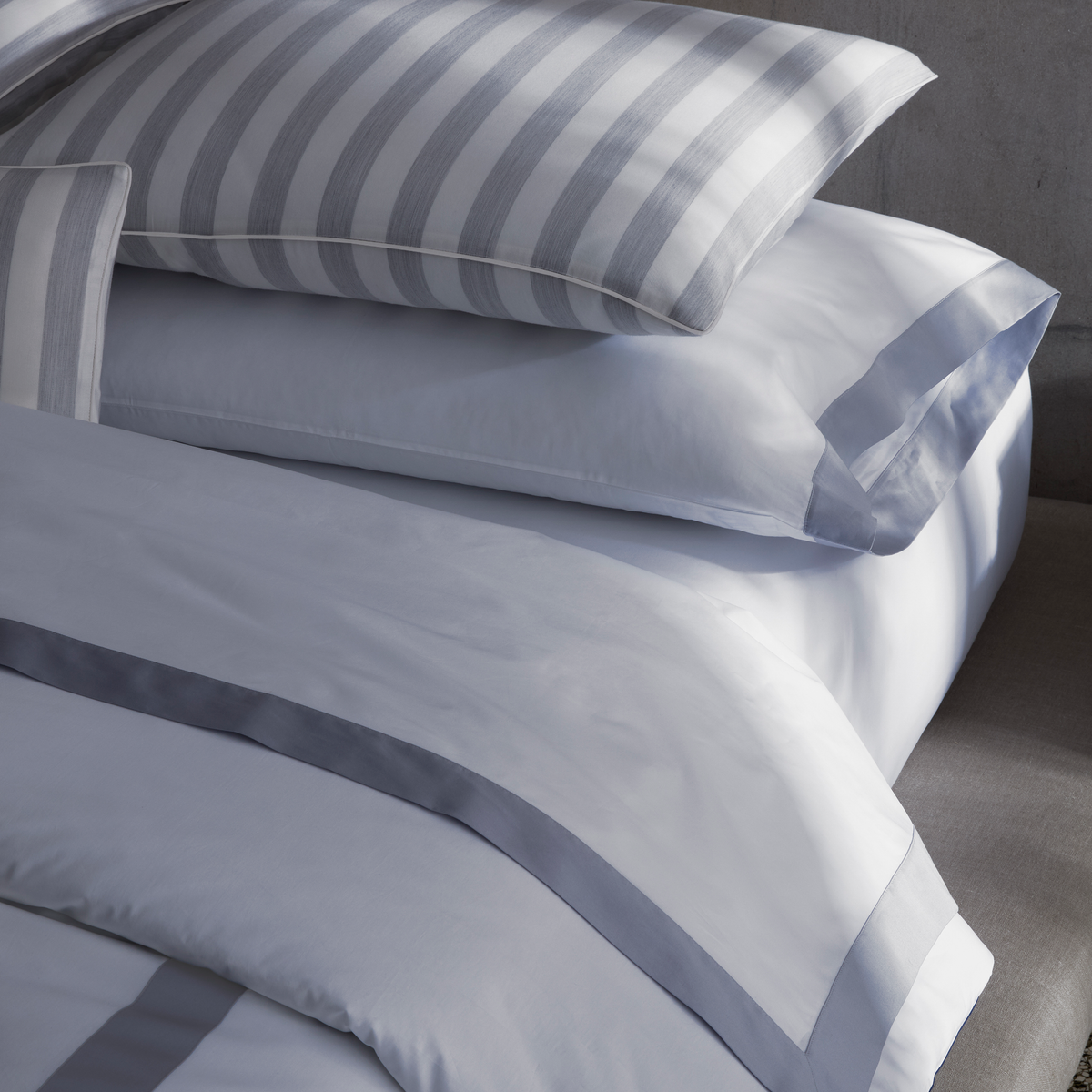 Detail view of Matouk Emory Bedding Shams in Dove color with Lana coordinate