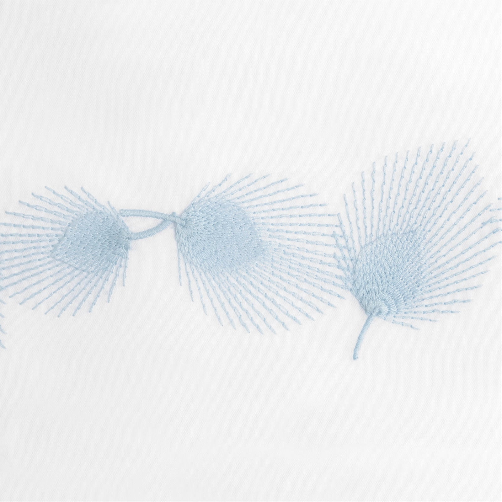 Stack of Matouk Feather Bedding Fine Linens in All Colors