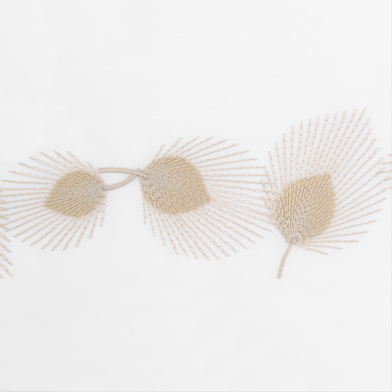 Full Bed Dressed in Matouk Feather Bedding with Swatch in Champagne Color