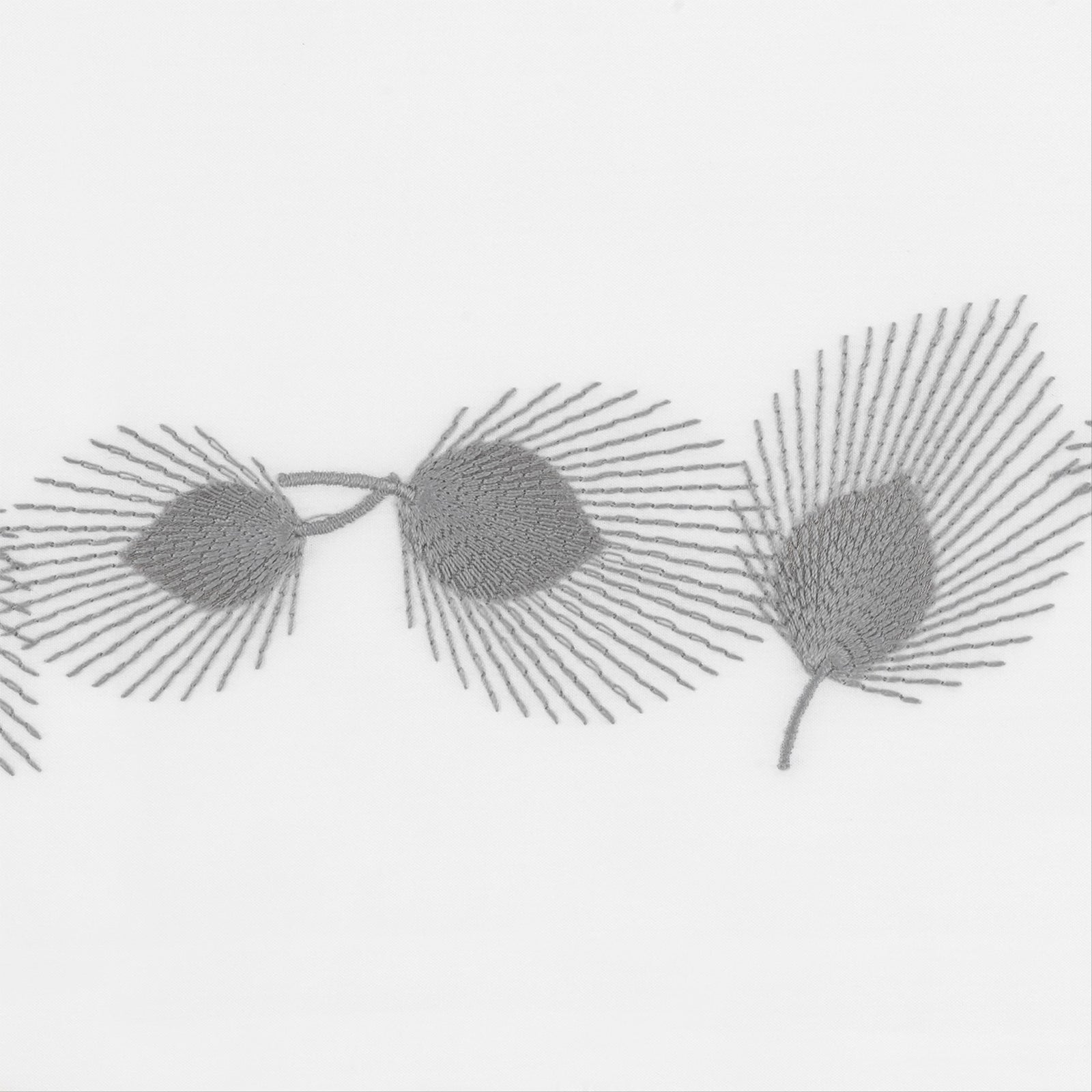 Full Bed Dressed in Matouk Feather Bedding with Swatch in Platinum Color