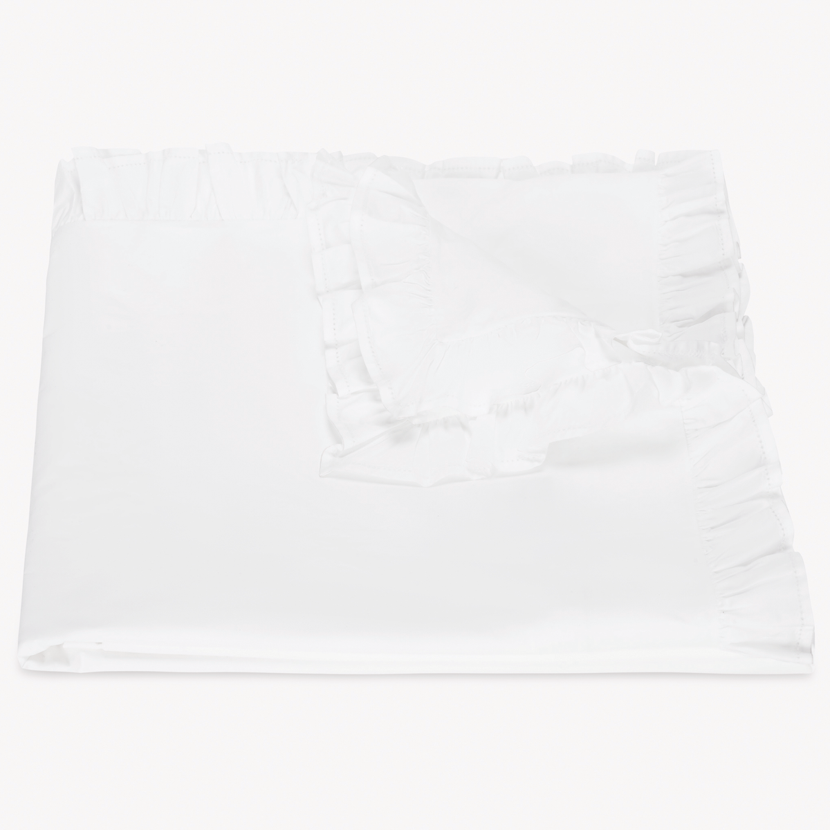 A folded white Duvet Cover with ruffled edges from Matouk Georgia Bedding