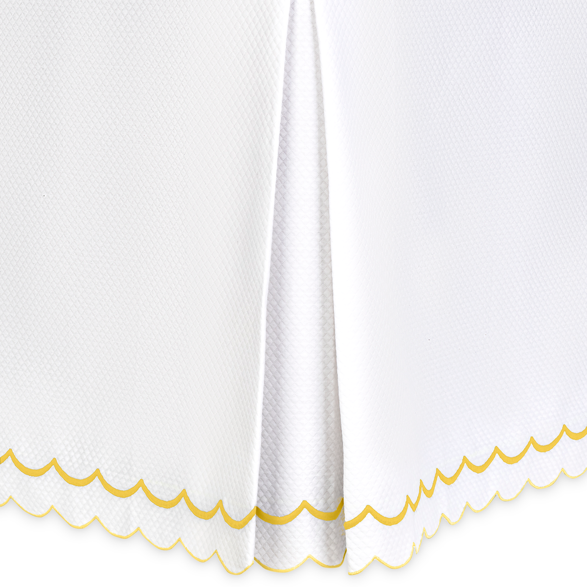 Closeup of Matouk India Pique Bedding Bedskirt in Lemon Color