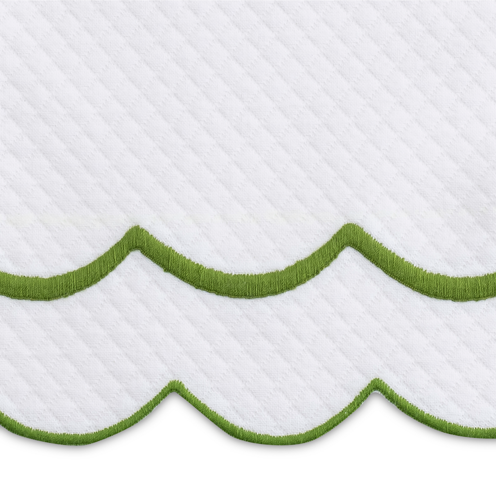 Full Bedding in a Room Dressed in Matouk India Pique Collection in Grass Color