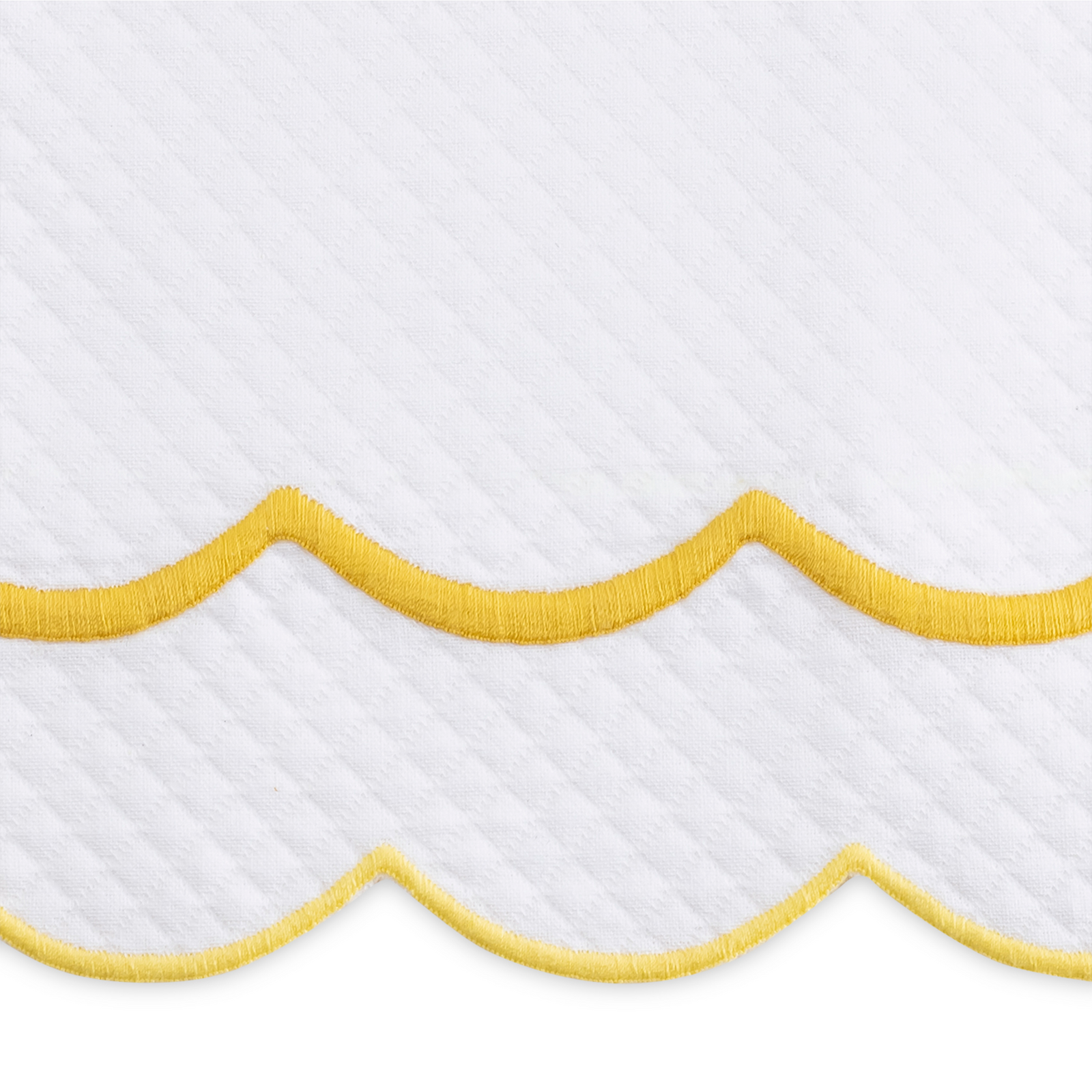 Full Bedding in a Room Dressed in Matouk India Pique Collection in Lemon Color