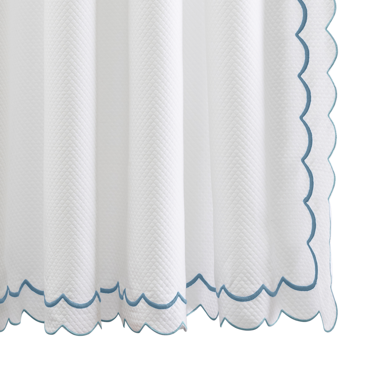Hanging Edges of Matouk Indie Pique Shower Curtain in Cerulean Color