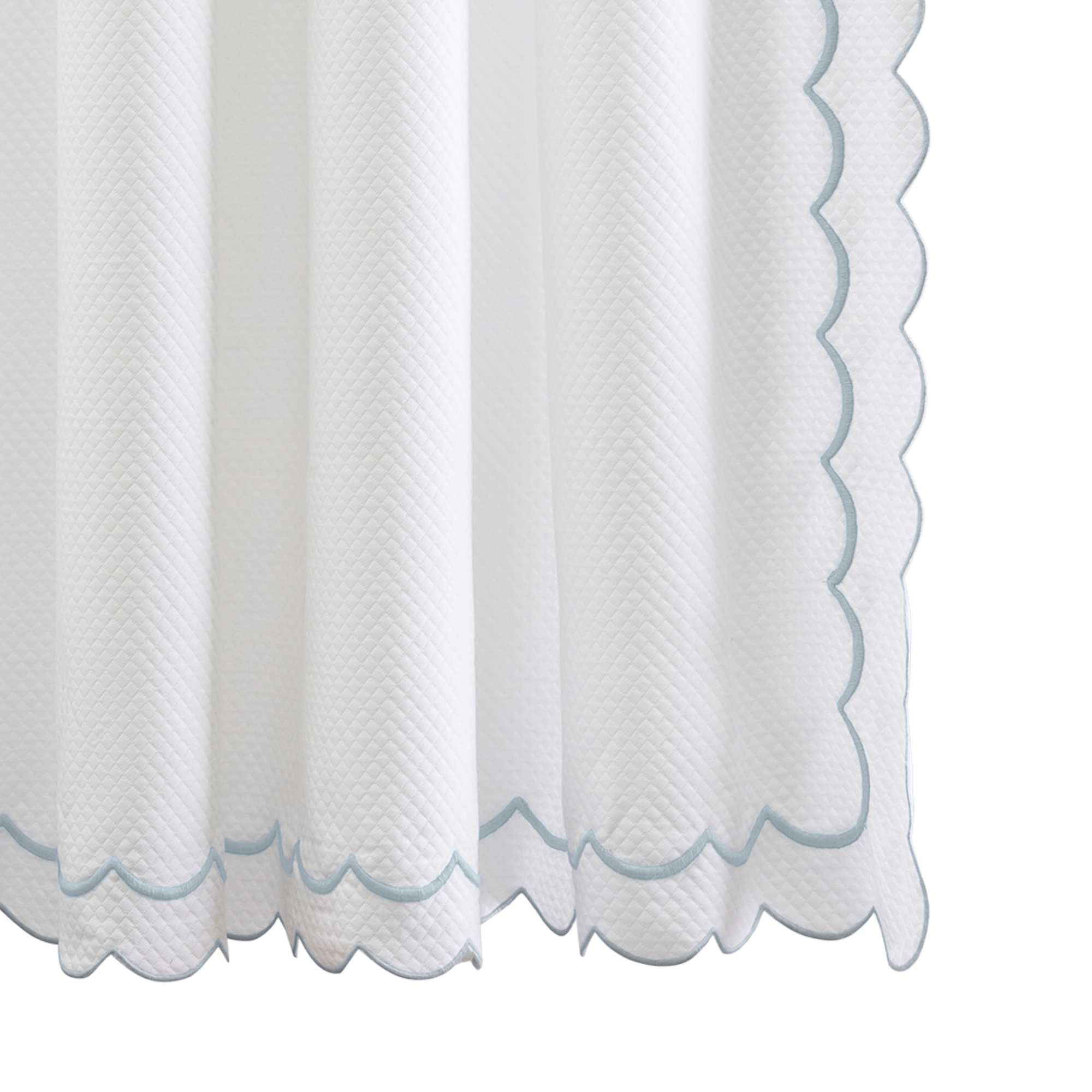Hanging Edges of Matouk Indie Pique Shower Curtain in Pool Color