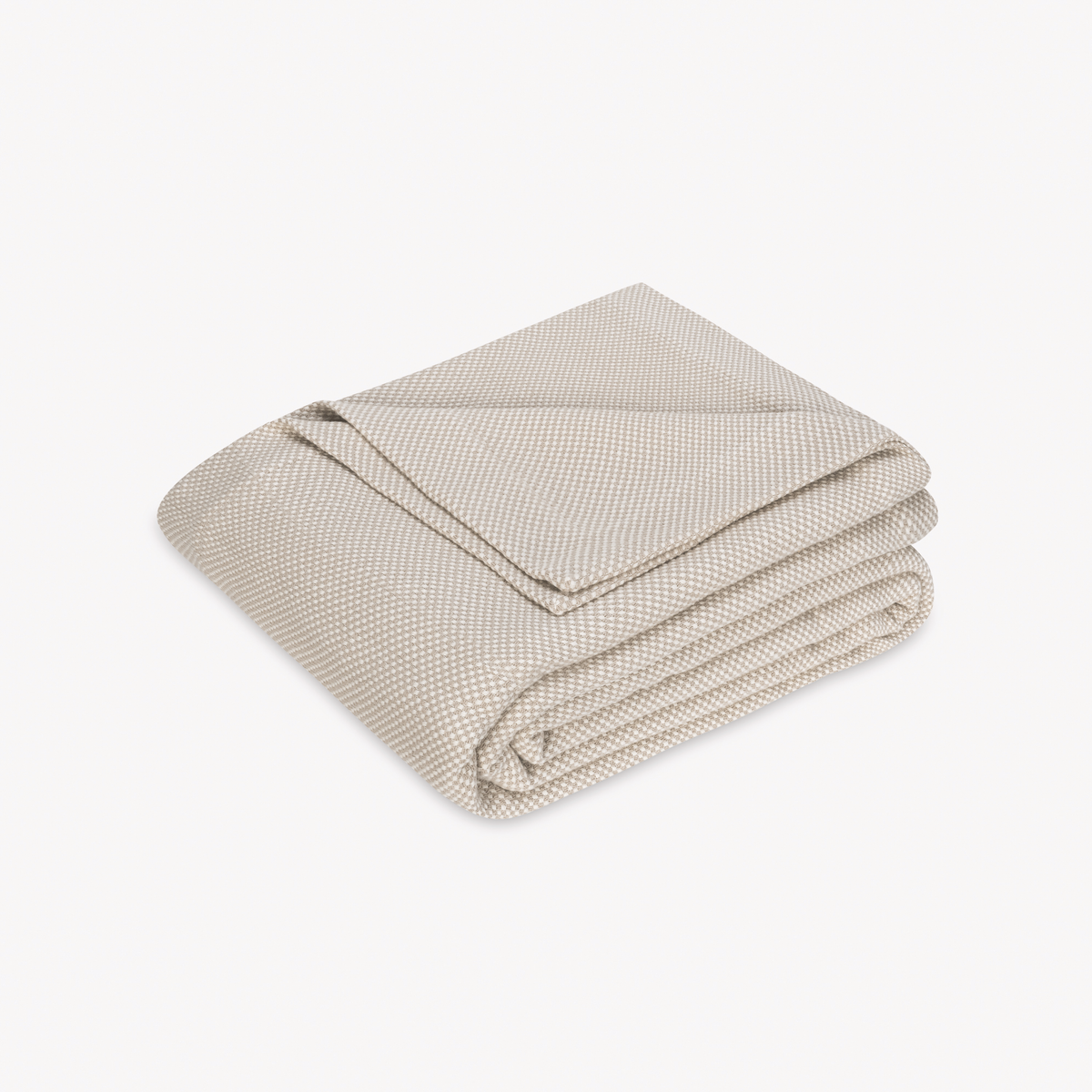 Folded Coverlet of Matouk Jackson Bedding in Dune