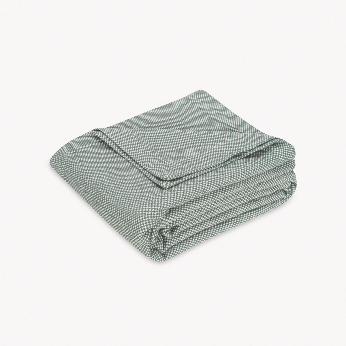 Folded Coverlet of Matouk Jackson Bedding in Jade