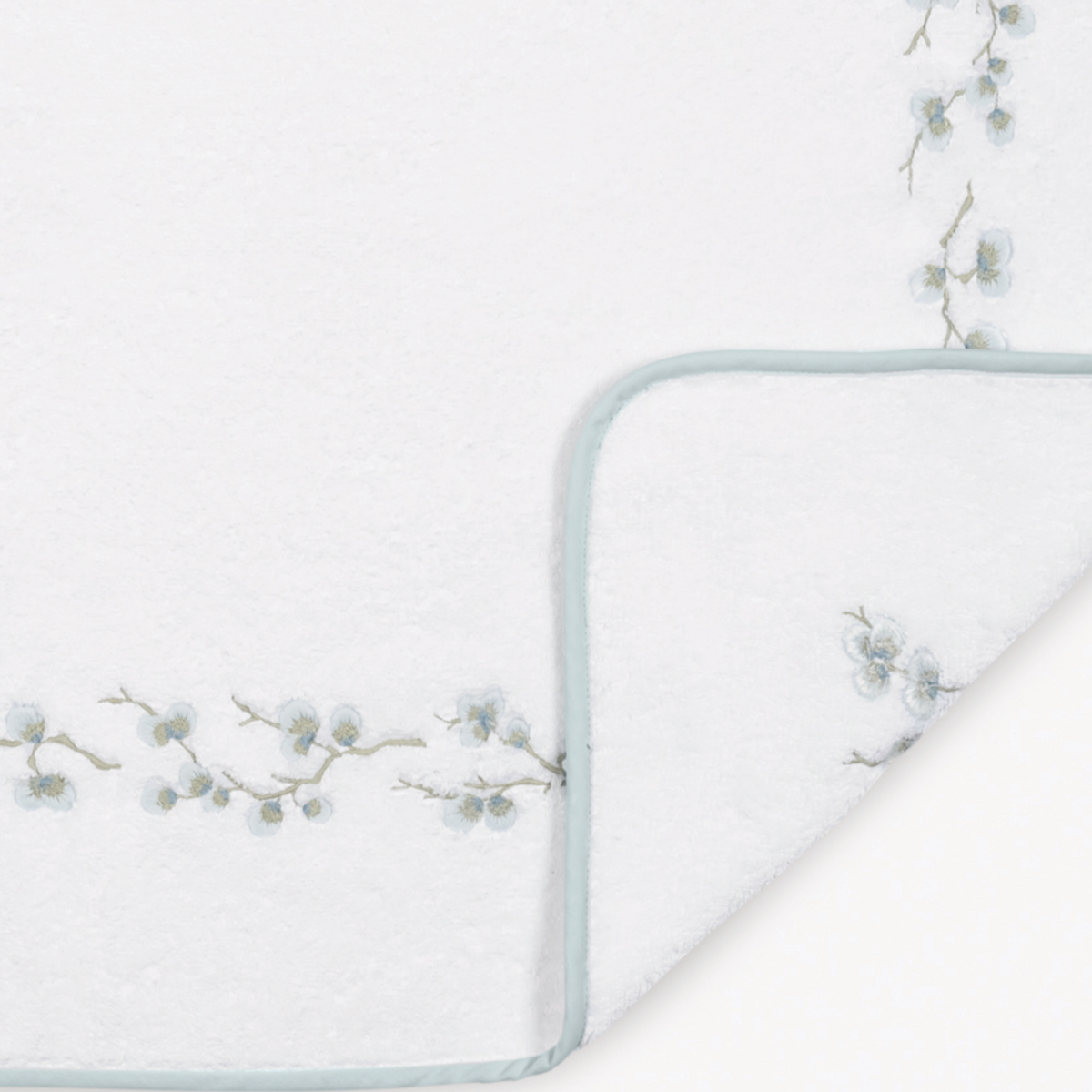 Fabric of Matouk Jasmine Giza Bath Towels and Mats in Pool color