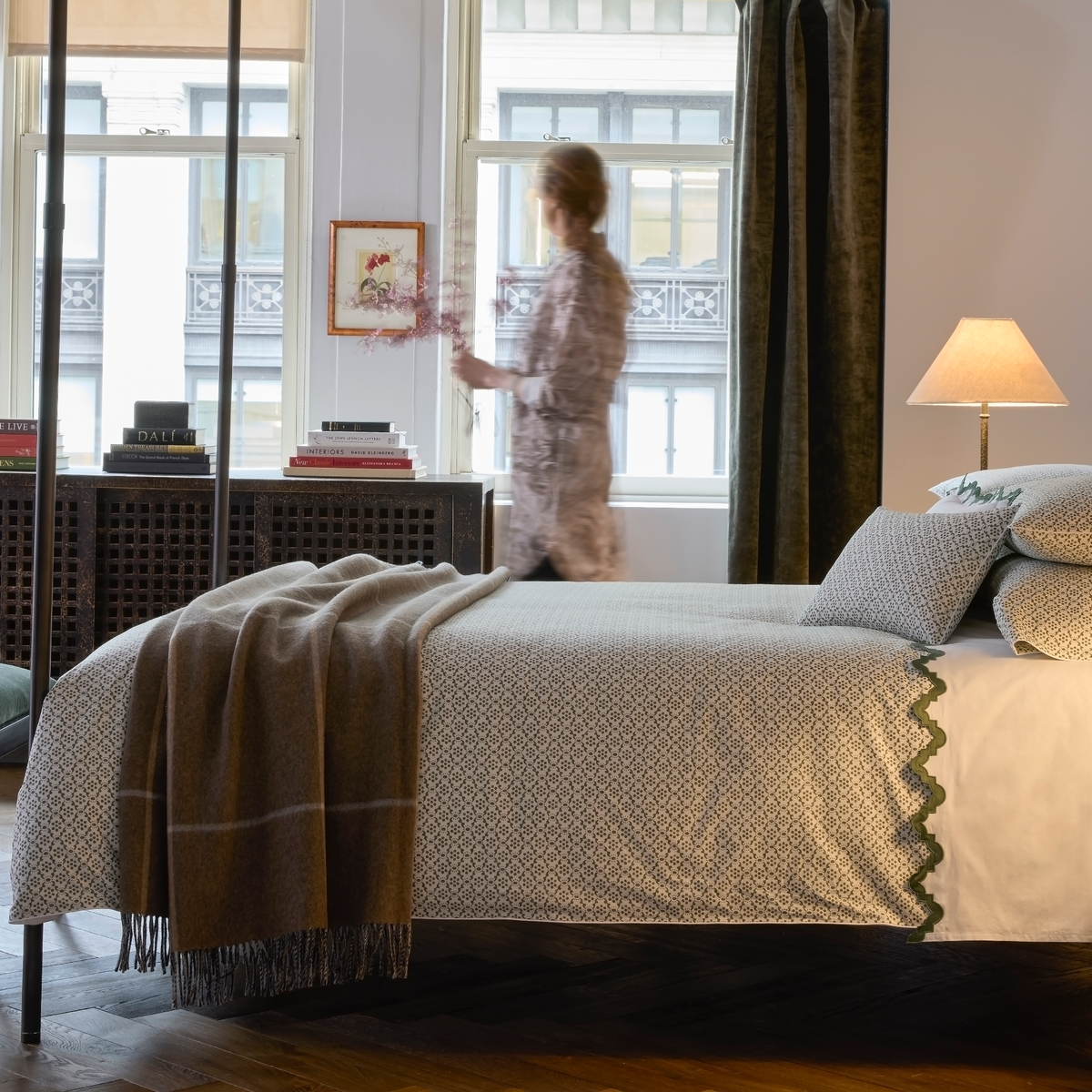 Bed with Matouk Laksha bedding with Benito bedding on top