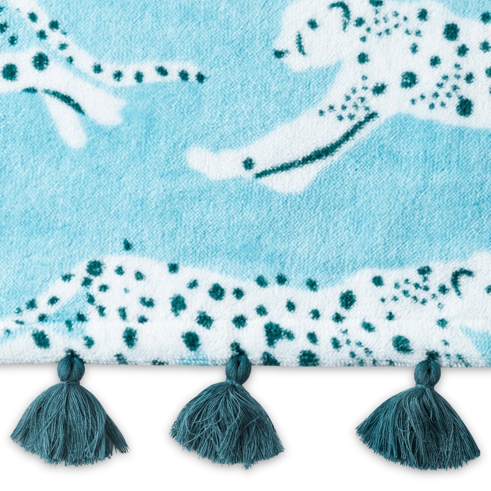 Folded Silo of Matouk Leaping Leopard Beach Towels in Color Surf