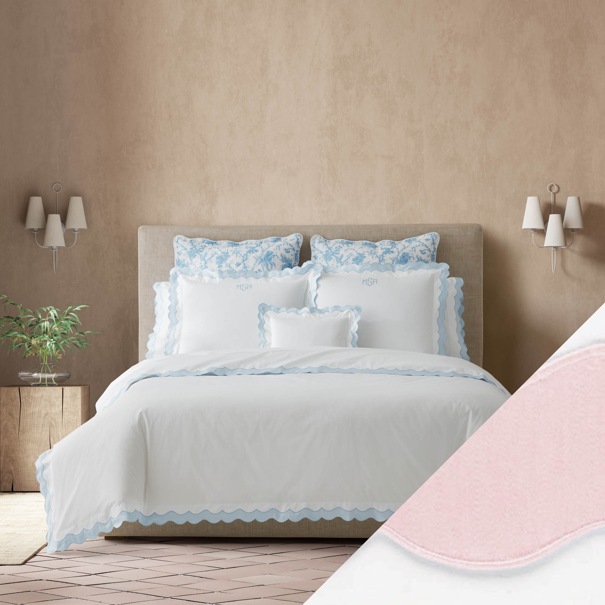 Full Bed Dressed in Matouk Lorelei Bedding in Blue Color with Pink Swatch