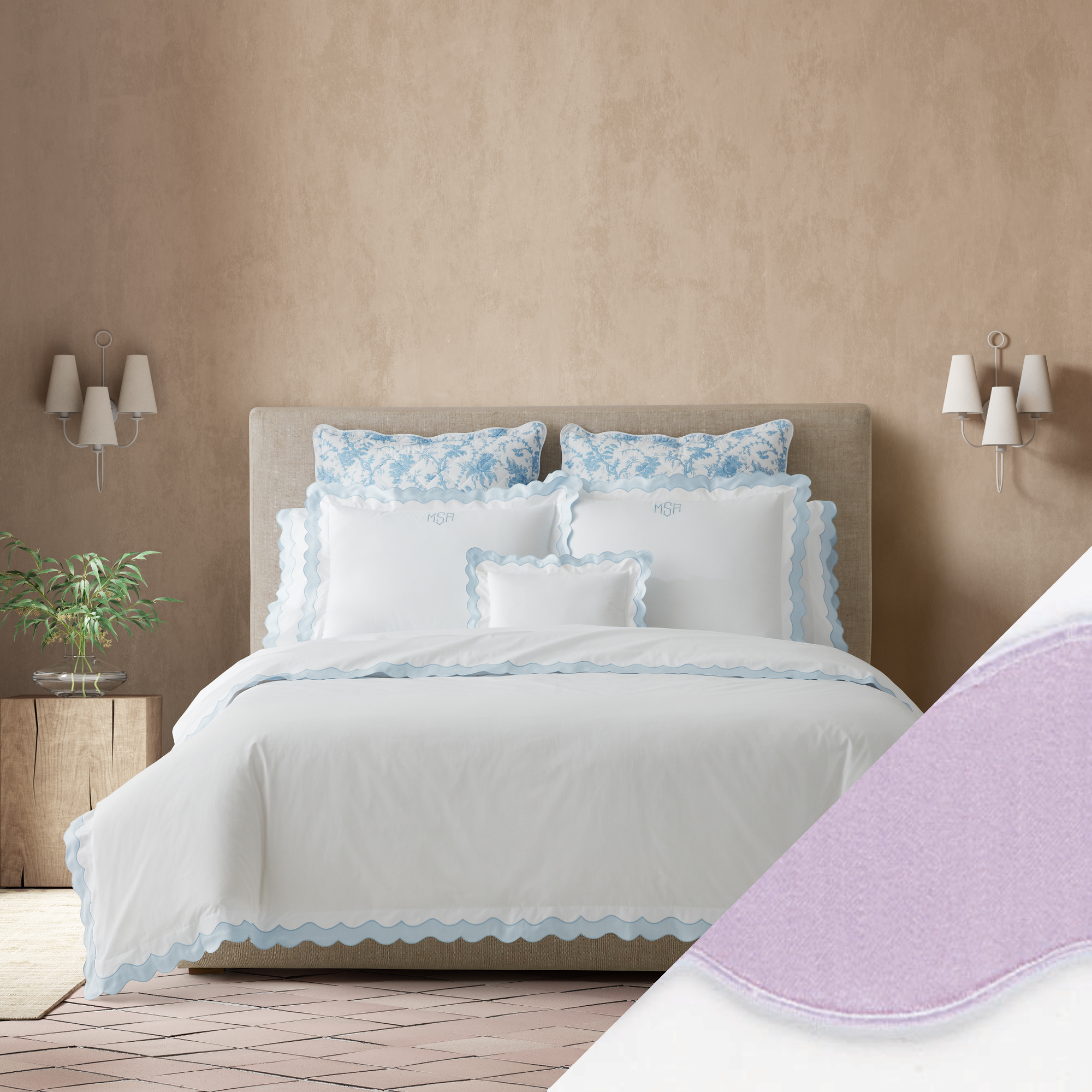 Full Bed Dressed in Matouk Lorelei Bedding in Blue Color with Violet Swatch