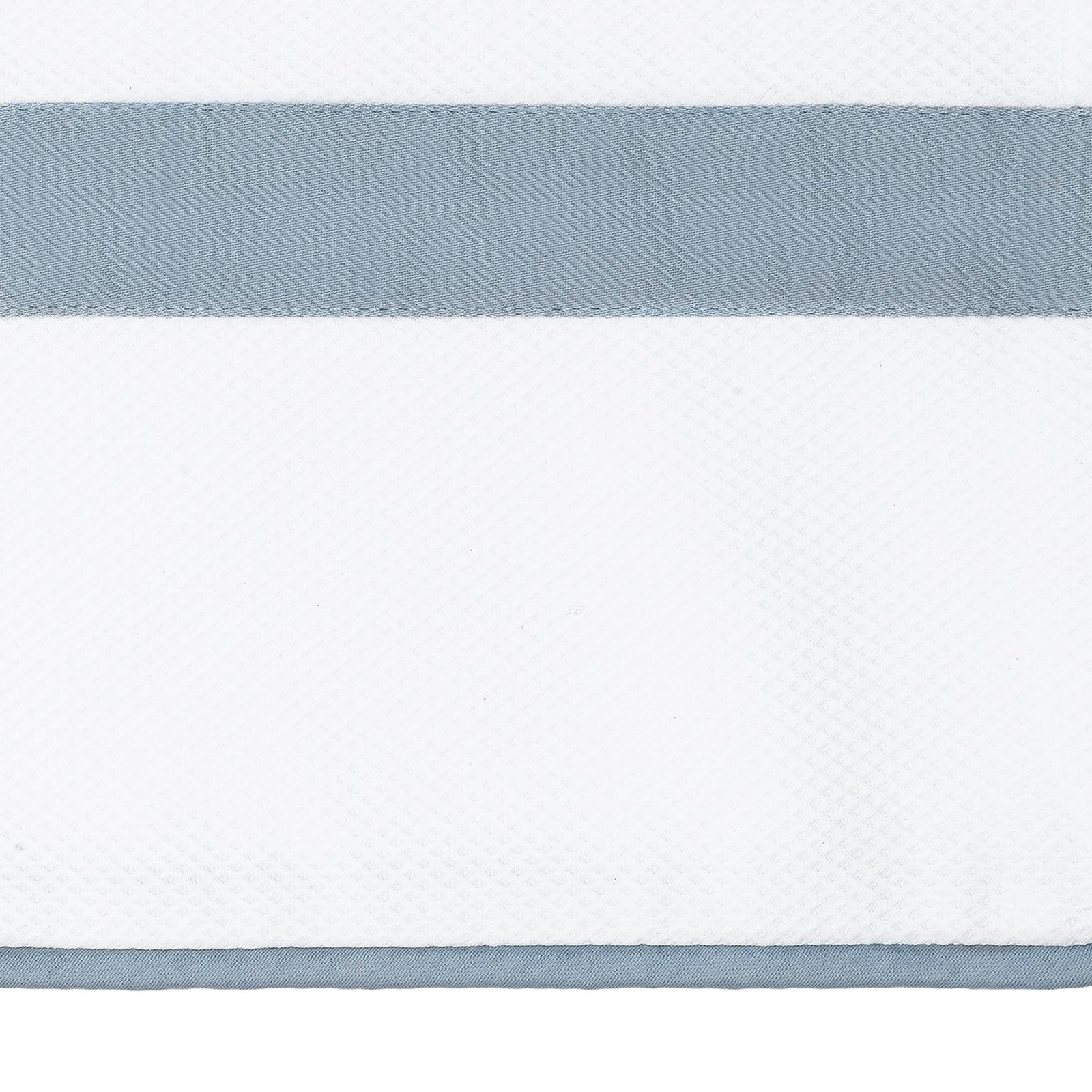 Bed Dressed in Matouk Louise Pique Bedding with Swatch in Color Hazy Blue