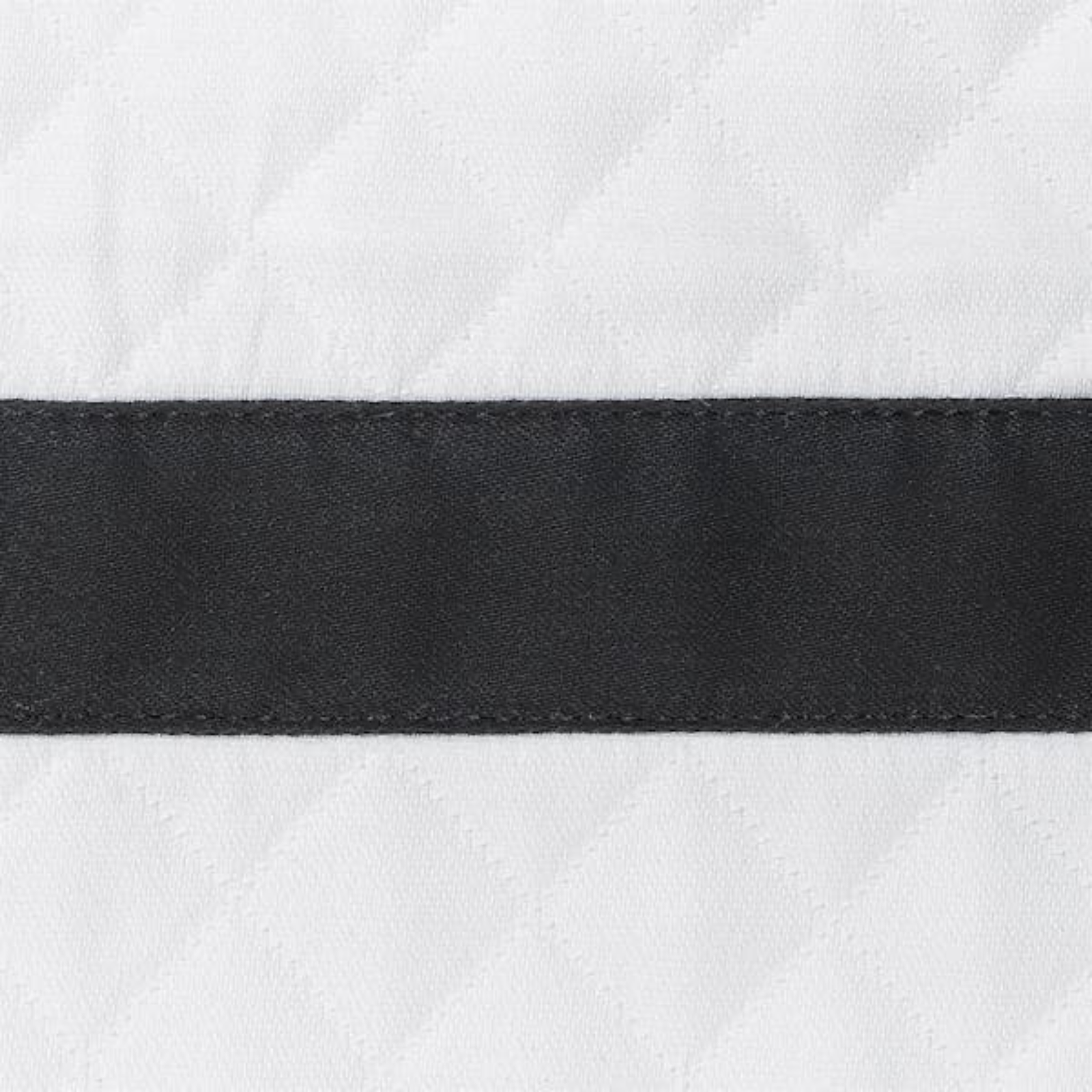 Sideview of Full Bed Dressed in Pool Matouk Lowell Matelassé Bedding with Black Swatch