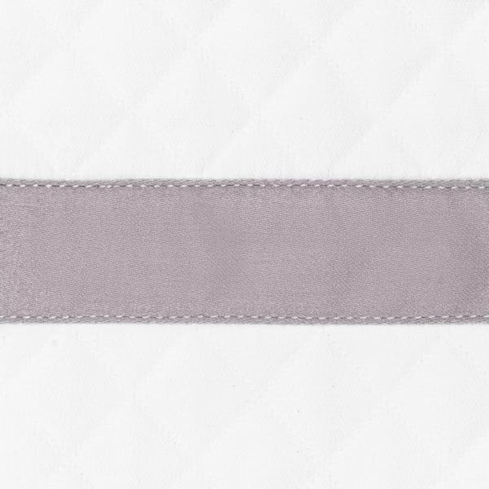 Sideview of Full Bed Dressed in Pool Matouk Lowell Matelassé Bedding with Deep Lilac Swatch