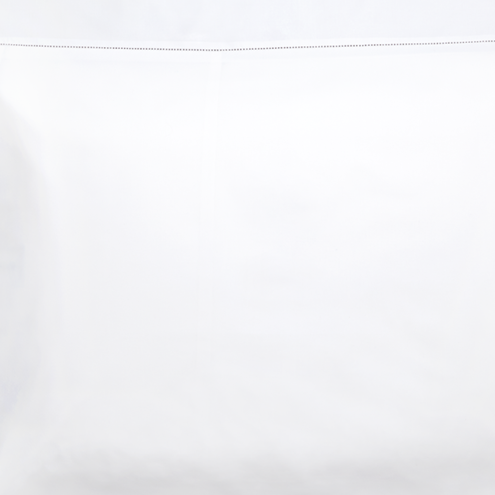 Stack of Matouk Luca Hemstitch Bedding in Assorted Colors