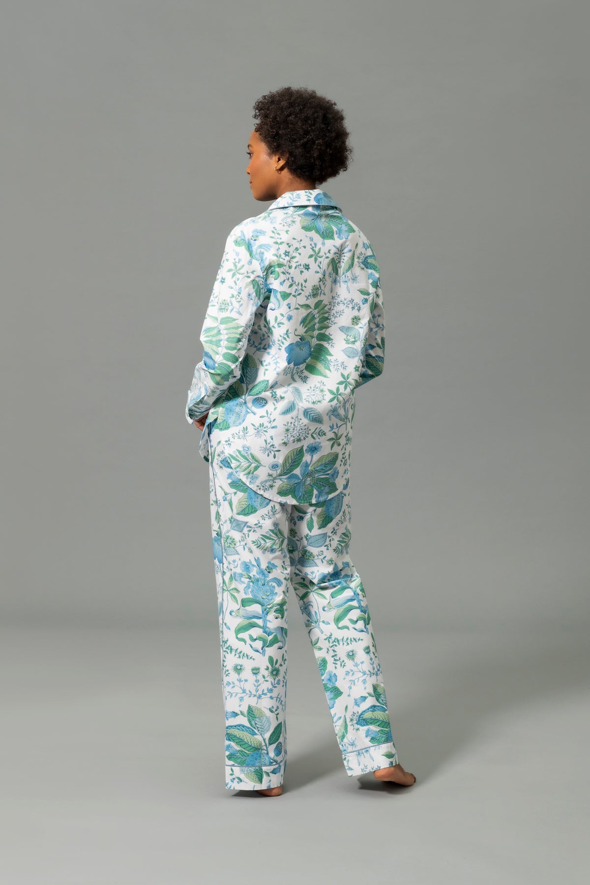 Back View of Model Wearing Matouk Luca Pajama Set in Color Levi Pomegranate Sea