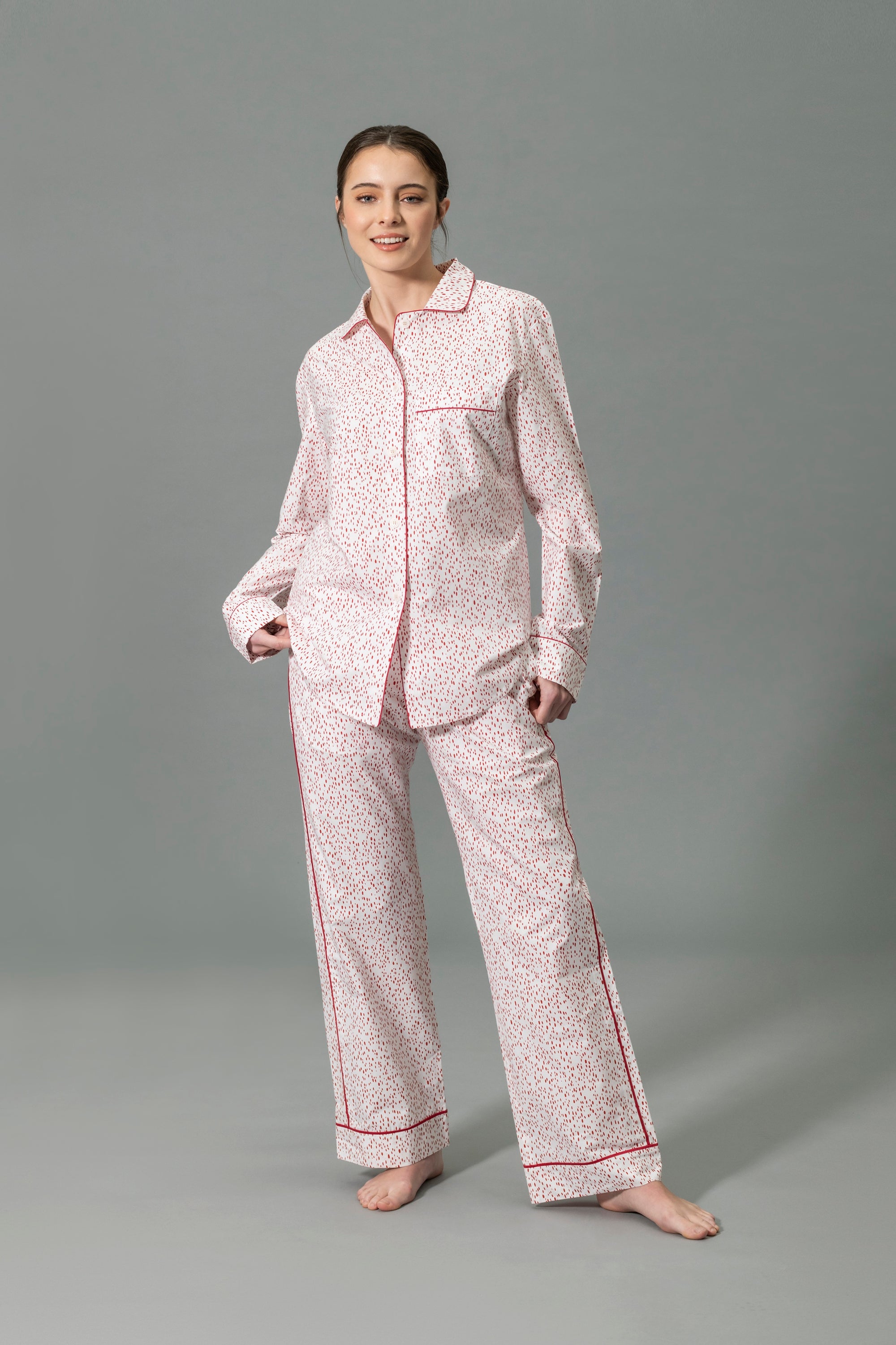 Front View of Model Wearing Matouk Luca Pajama Set in Color Celine Redberry