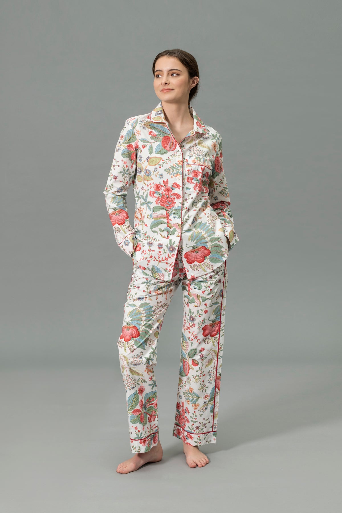 Front View of Model Wearing Matouk Luca Pajama Set in Color Levi Pomegranate Pink Coral