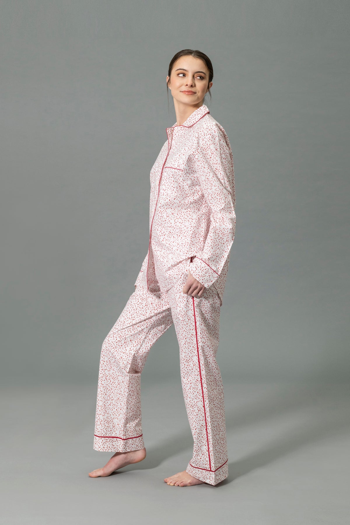Side View of Model Wearing Matouk Luca Pajama Set in Color Celine Redberry