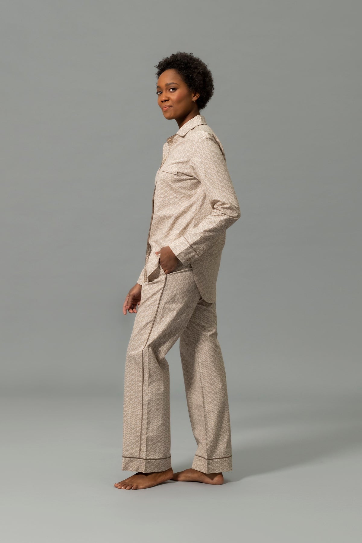 Side View of Model Wearing Matouk Luca Pajama Set in Color Levi Dune